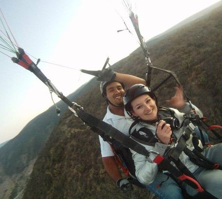 crazy sexy fun traveler paragliding in Mexico