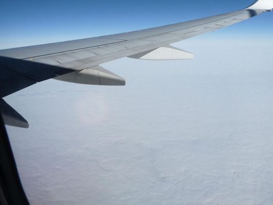 a plane flying above the sky