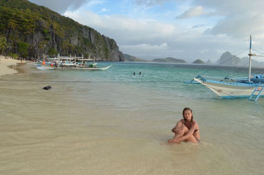 crazy sexy fun traveler on 7 Commandos island beach in Palawan