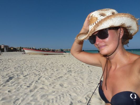 crazy sexy fun traveler on Playa del Carmen beach in Mexico