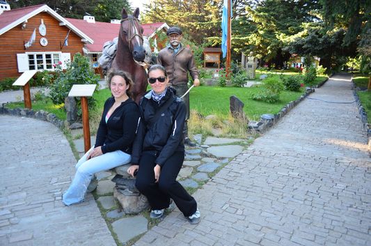 inside Intendencia Parque Nacional de los Glaciares with Francisco Moreno statue - me and Lyra