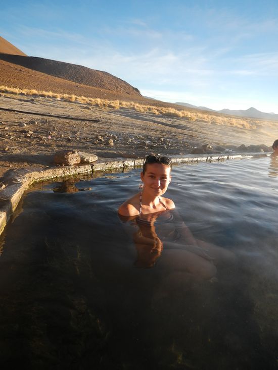 crazy sexy fun traveler bathing in hot springs of Laguna Salada