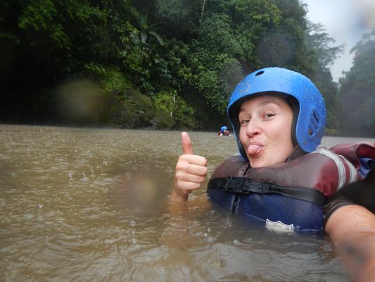 crazy sexy fun traveler swimming in the rain