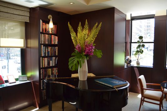 Library Hotel Club room piano and books