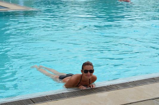 crazy sexy fun traveler swimming in Hotel Solverde Spa & Wellness