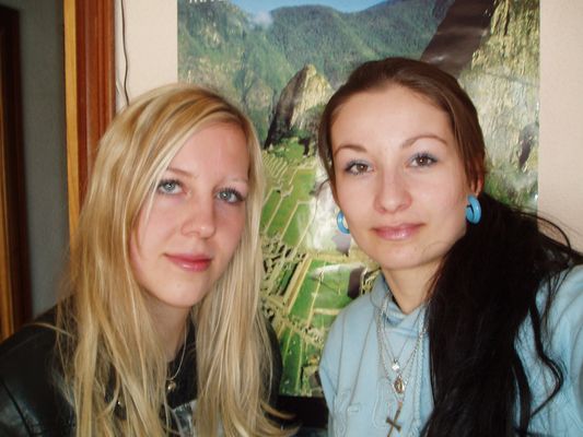 with my friend Kami in Madrird with Machu Picchu photo behind