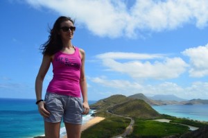 with South East Peninsula of St. Kitts behind crazy sexy fun traveler