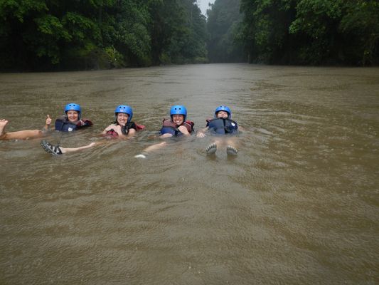 swimming in the rain after rafting Pacuare river in Costa Rica
