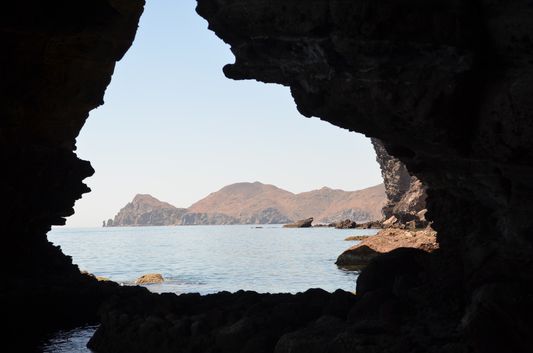 view of the Isla Espiritu Santo coast from a cave