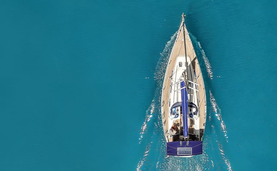 A yacht from above in the open sea