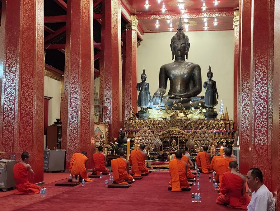 evening chanting with monks Wat Ong Teu Vientiane Laos