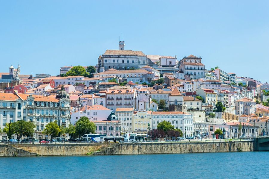 View of the city of Coimbra in Portugal during day time from the river