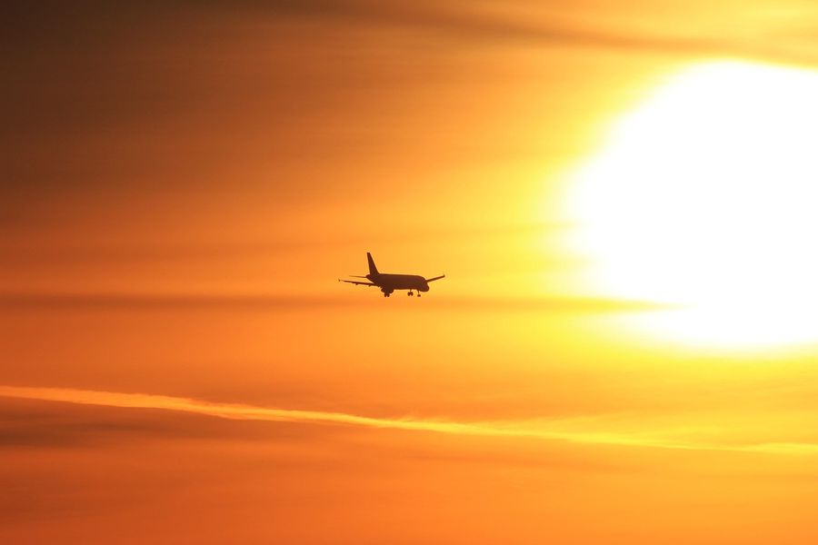 traveling by plane at sunset